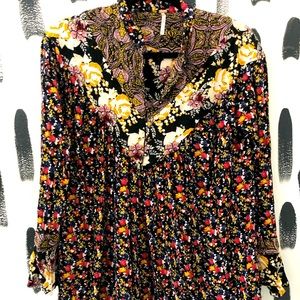 Free people tunic with function button front. Wrist bell sleeve.